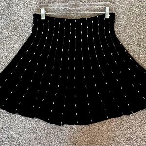 Full twirly skirt. Lightweight sweater material, size medium, black.